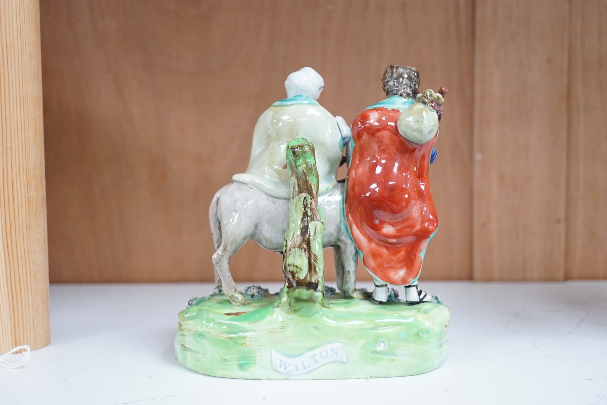 An early 19th century pearlware ‘flight to Egypt’ group, by Walton, 16.5 cm high. Condition - some restoration and bocage lacking